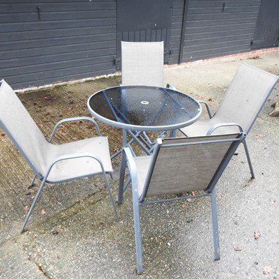 Lot 24 - A glass top circular garden table