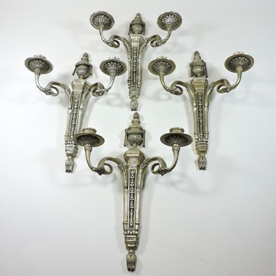 Lot 637 - A set of four silver plated wall sconces