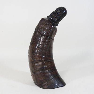 Lot 191 - A carved horn Buddha