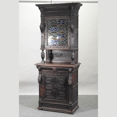 Lot 274 - A late 19th century carved oak cabinet