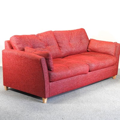 Lot 724 - A modern red upholstered sofa bed