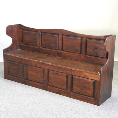 Lot 520 - A stained pine box settle