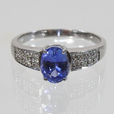 Lot 568 - An 18 carat gold sapphire and diamond ring