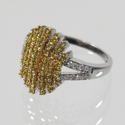 Lot 571 - A 9 carat gold white and yellow diamond ring