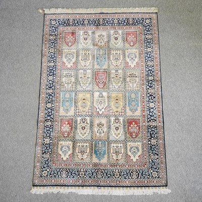 Lot 683 - A Persian silk and woollen rug