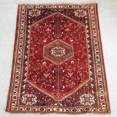 Lot 582 - A large Fired Earth Persian style rug