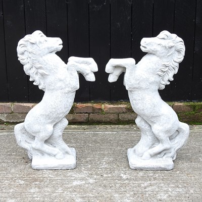 Lot 410 - A pair of reconstituted stone horses