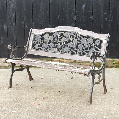 Lot 433 - A green painted metal and wooden garden bench