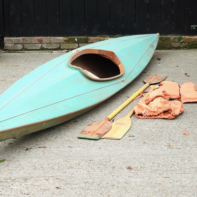 Lot 404 - A vintage wooden canoe