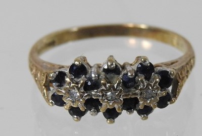Lot 166 - A 9 carat gold sapphire and diamond triple cluster ring