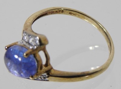 Lot 170 - A 9 carat gold diamond crossover cabochon dress ring