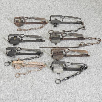 Lot 439 - Eight 19th century iron gin traps