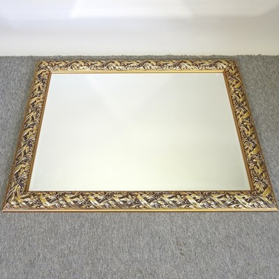 Lot 685 - A carved gilt wall mirror