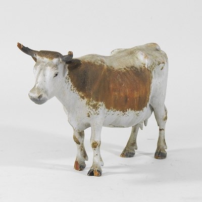 Lot 577 - A painted wooden model of a cow