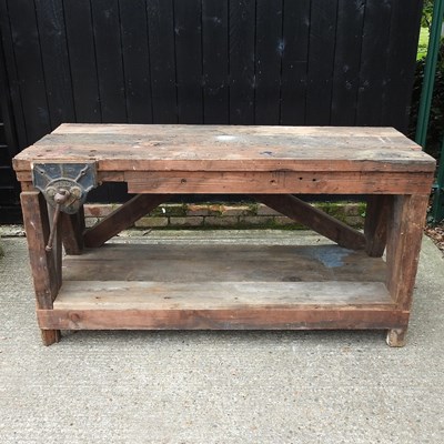 Lot 318 - A work bench fitted with a vice