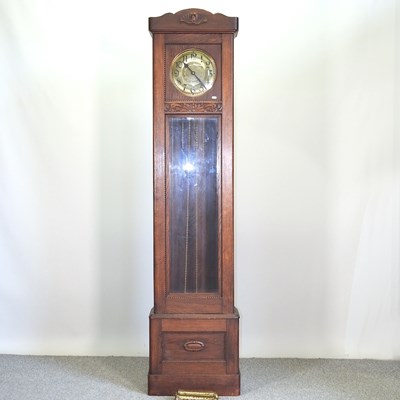 Lot 362 - A 1920's oak cased longcase clock