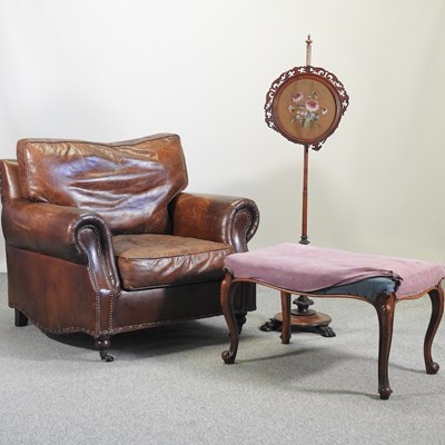 Lot 621 - A 1920's style brown leather upholstered armchair