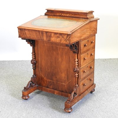 Lot 569 - A Victorian walnut davenport