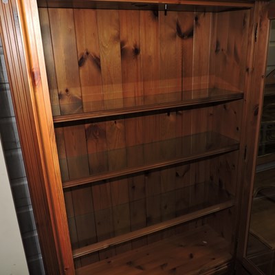 Lot 45 - A modern pine cabinet bookcase
