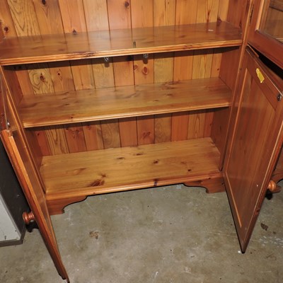 Lot 45 - A modern pine cabinet bookcase