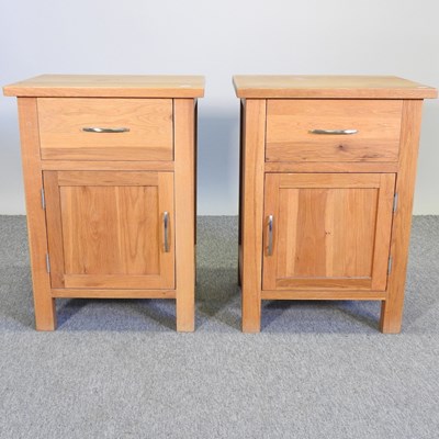 Lot 364 - A pair of modern light oak bedside cabinets