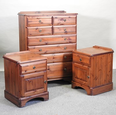 Lot 257 - A modern stained pine chest of drawers