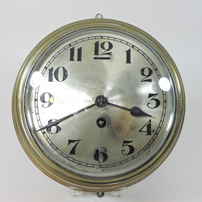 Lot 61 - An early 20th century brass cased bulkhead clock