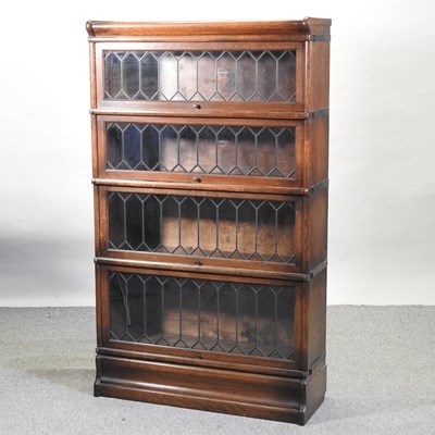 Lot 462 - An early 20th century Globe Wernicke graduated four tier glazed sectional bookcase