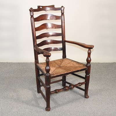 Lot 552 - A Lancashire carver chair, with rush seat