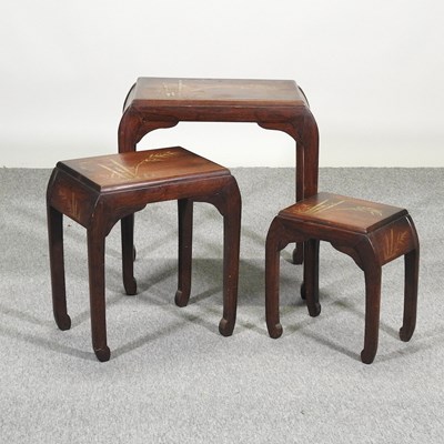 Lot 487 - A nest of three oriental tables