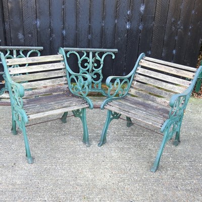 Lot 338 - A pair of cast iron armchairs