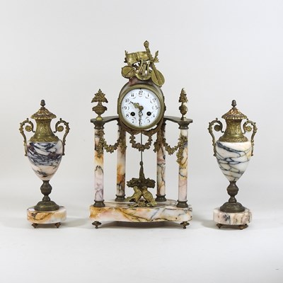 Lot 159 - A continental three piece clock garniture