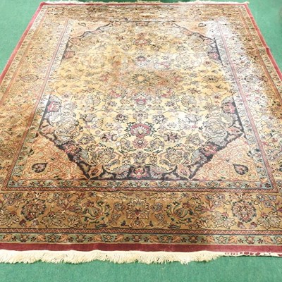 Lot 477 - A large woollen carpet