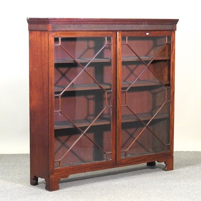 Lot 555 - An early 20th century dwarf glazed bookcase