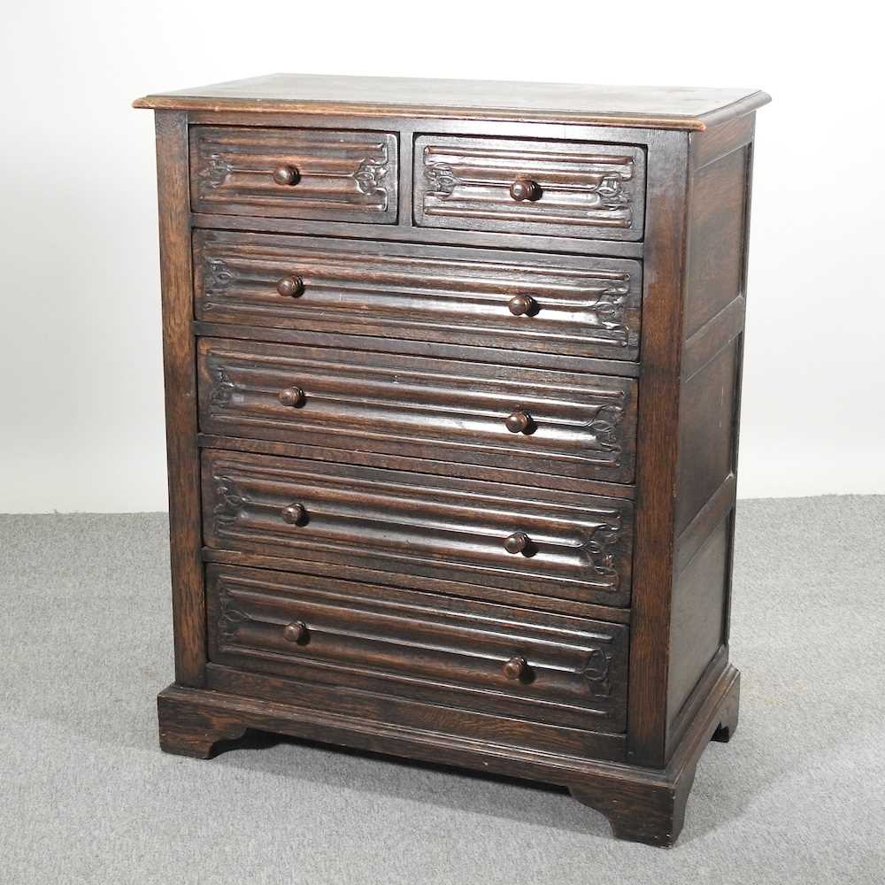 Lot 554 - A dark oak chest