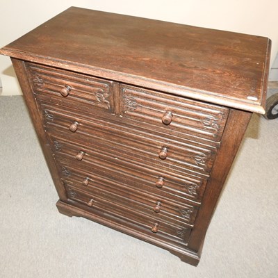 Lot 554 - A dark oak chest