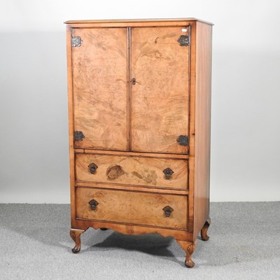 Lot 629 - A 1920's walnut tallboy