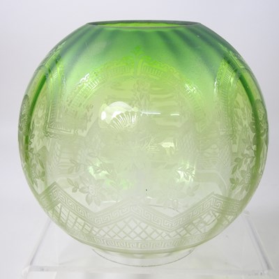 Lot 17 - A green etched glass oil lamp shade