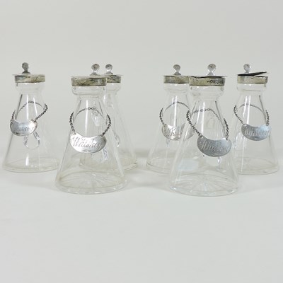 Lot 90 - A set of five George V silver mounted whiskey tots