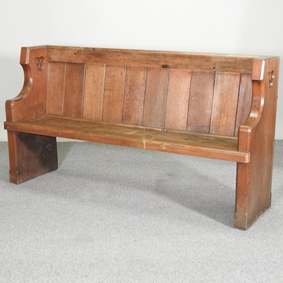 Lot 429 - A 19th century carved oak pew