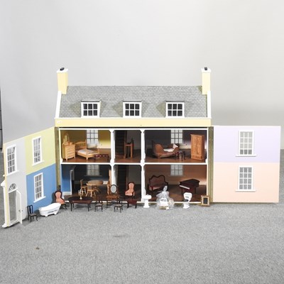 Lot 436 - A painted wooden dolls house