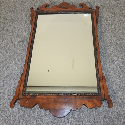 Lot 616 - A George III walnut and parcel gilt wall mirror