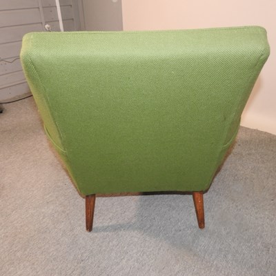 Lot 623 - A 1960's green upholstered armchair