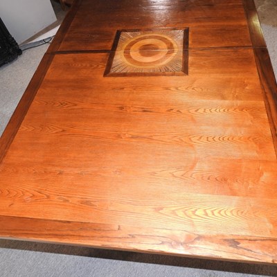 Lot 630 - A contemporary inlaid hardwood dining table