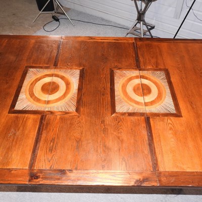 Lot 630 - A contemporary inlaid hardwood dining table