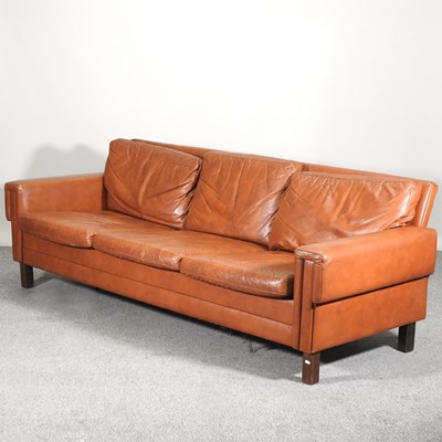 Lot 614 - A 1970's Danish brown leather upholstered sofa