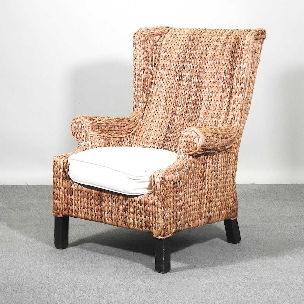 Lot 393 A modern wicker armchair