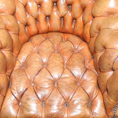 Lot 43 - A George IV leather button back library armchair