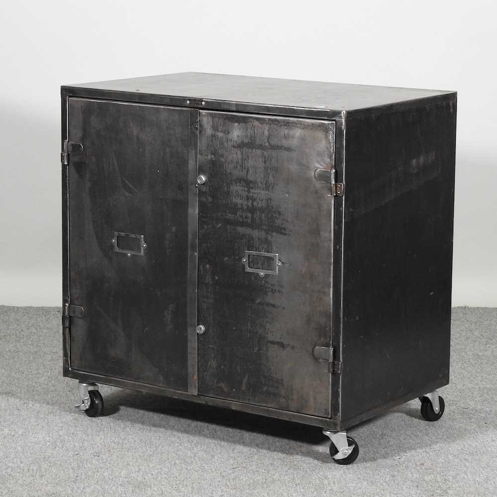 Lot 613 - An industrial style metal side cabinet