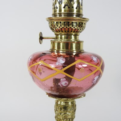Lot 89 - A pair of 19th century brass and cranberry glass oil lamps